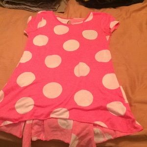Dress shirt pink with white polka dots.